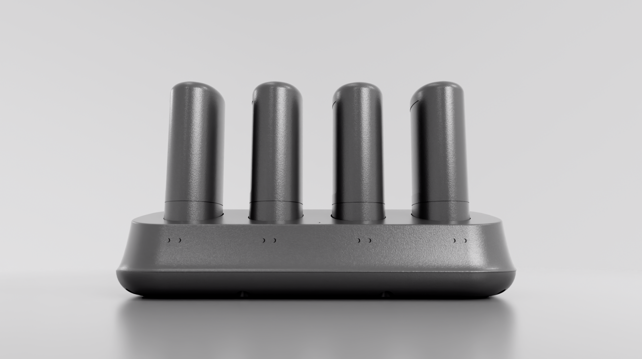 Four battery packs standing in the IRIS charging cradle.